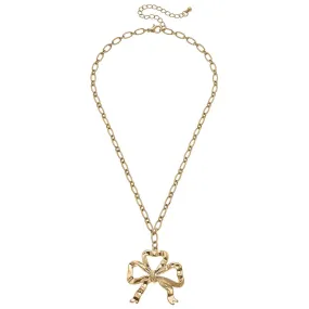 GREYSON BOW PENDANT NECKLACE IN WORN GOLD